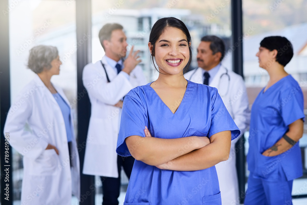 Wall mural Team, hospital and portrait of nurse with crossed arms for medical service, insurance or collaboration. Professional, healthcare student and woman in clinic for wellness, medicare and consulting