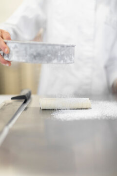 chef sifting sugar 