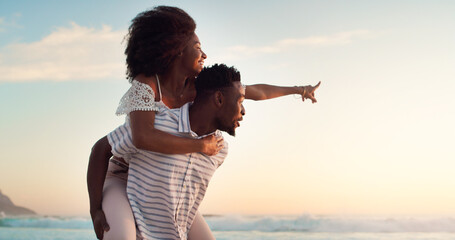 Black couple, piggyback and holiday at beach for travel, adventure and happiness. Love, explore and...