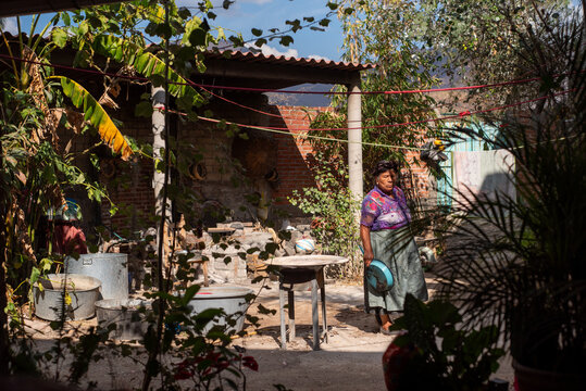 Mexican backyard with senior woman