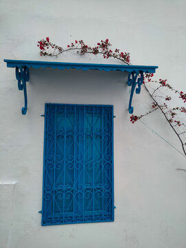 Sidi Bou Said, a famous village with traditional white and blue Tunisian architecture and wrought iron window. Tunisia.