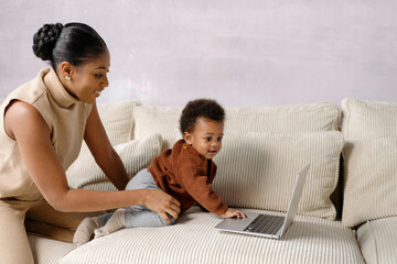 Mother and Child Enjoying Laptop Time at home