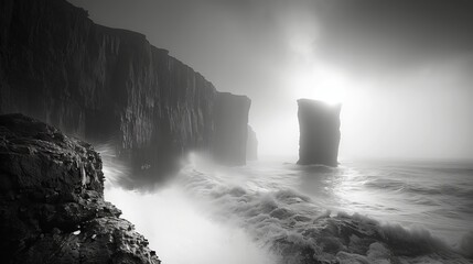Monochromatic photo of a rock formation in the ocean under a dramatic sky - obrazy, fototapety, plakaty
