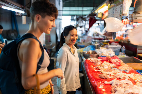 Women at food market.