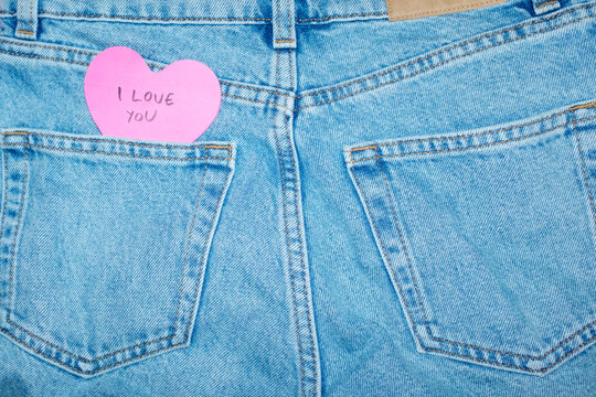 Classic blue jeans with heart-shaped post it note & "I love you" text