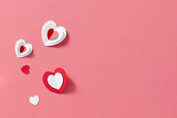 Handicraft hearts on red background