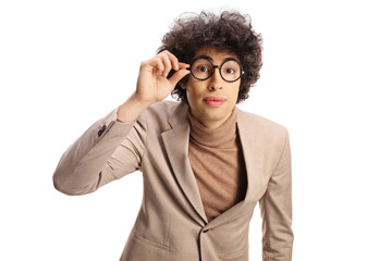 Curious young man looking through his glasses