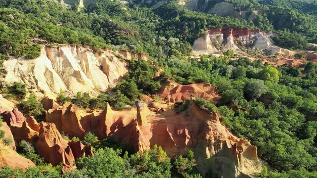 Aerial footage of Red sands and abstract Rustrel canyon moher cliffs landscape. Provencal Colorado near Roussillon,in the Vaucluse department - Southern France.