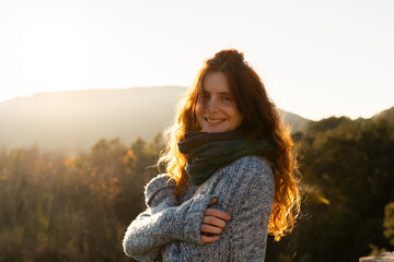  Happy woman in nature at sunset
