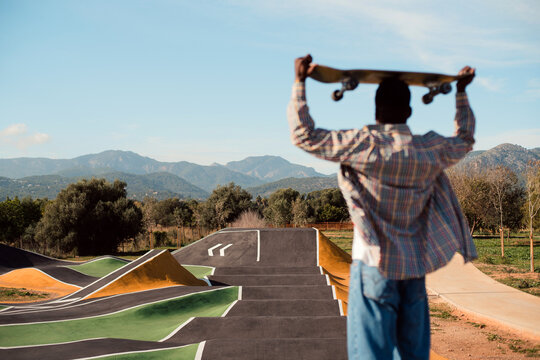 Skateboarder looking at ramp