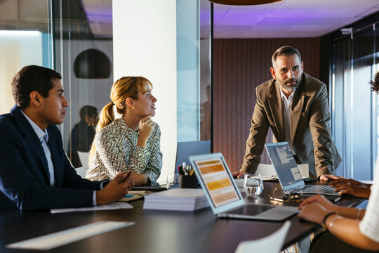 Financial advisors having a meeting in office