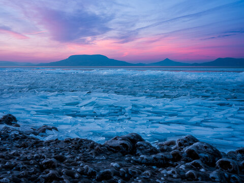 Frosted lake and mountain. Icy wonferland
