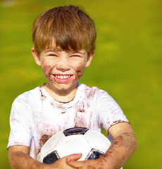 Portrait, smile and child with football outdoor for sports, exercise or game at garden in summer....