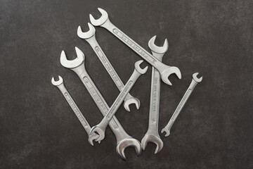 Open-end wrenches. Set of wrenches on grey background.