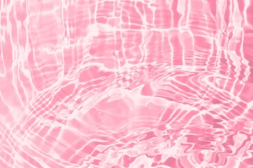 Pink water texture, aqua surface with ripples, splashes and bubbles. Abstract summer background for skin care cosmetics advertisement