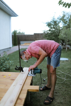 a man makes a terrace in the yard