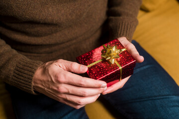 Male hands holding special shiny gift