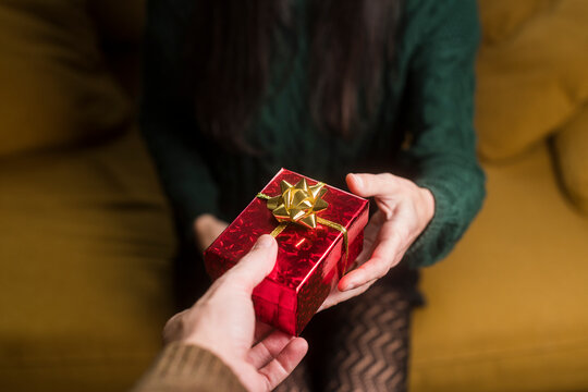 Anonymous couple gift giving POV
