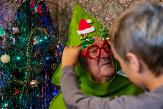 child dress up grandpa as xmas tree , ugc