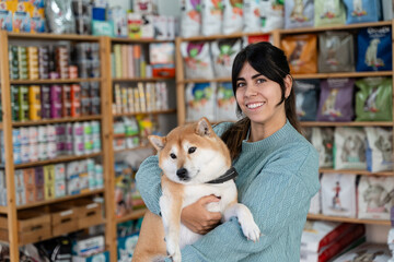 Woman with dog at pet store.