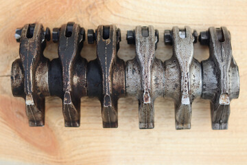 Factory intake rocker arms are clean and dirty, top view.