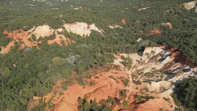 Aerial footage of Red sands and abstract Rustrel canyon moher cliffs landscape. Provencal Colorado near Roussillon,in the Vaucluse department - Southern France.
