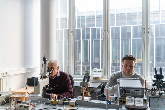 Researchers Working In Lab Of Electronic Processes