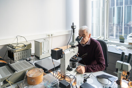 Scientist Working In Lab Of Electronic Processes
