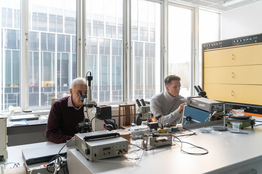 People Working In Lab Of Electronic Processes