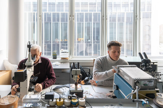 Scientist Working In Lab Of Electronic Processes