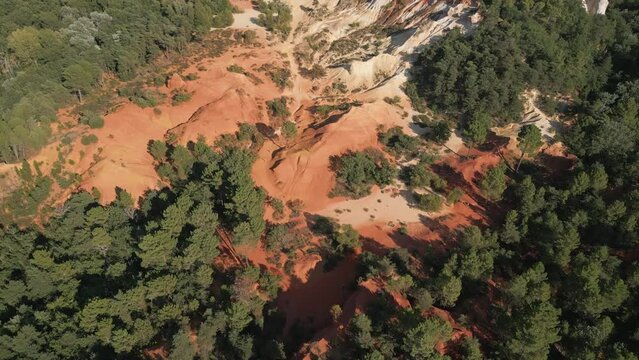 Aerial footage of Red sands and abstract Rustrel canyon moher cliffs landscape. Provencal Colorado near Roussillon,in the Vaucluse department - Southern France.