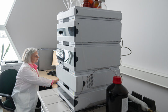 Researcher Using High Performance Liquid Chromatography Instrument