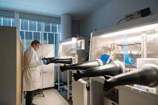 Male Researcher Using The Glovebox
