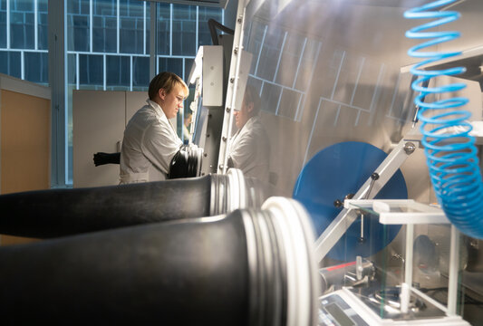 Male Researcher Using The Glovebox