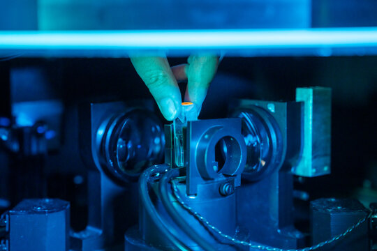 Anonymous Scientist Hand Holding Diode Laser