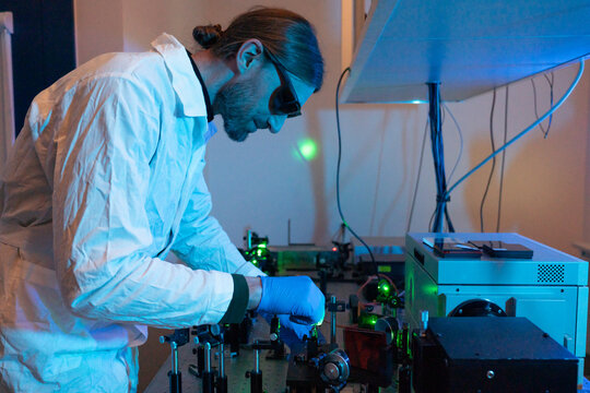 Male Researcher Using Laser Technologies
