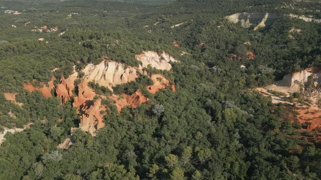 Aerial footage of Red sands and abstract Rustrel canyon moher cliffs landscape. Provencal Colorado near Roussillon,in the Vaucluse department - Southern France.