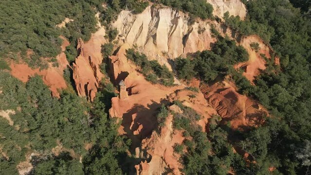 Aerial footage of Red sands and abstract Rustrel canyon moher cliffs landscape. Provencal Colorado near Roussillon,in the Vaucluse department - Southern France.