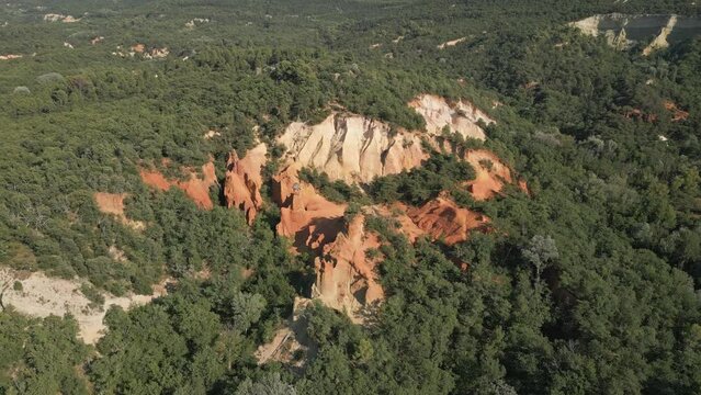 Aerial footage of Red sands and abstract Rustrel canyon moher cliffs landscape. Provencal Colorado near Roussillon,in the Vaucluse department - Southern France.