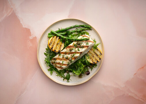 Grilled halibut with capers and greens.