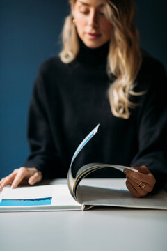 Woman flips through book