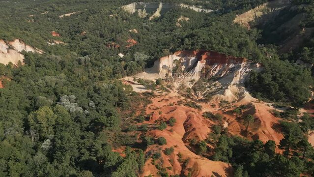 Aerial footage of Red sands and abstract Rustrel canyon moher cliffs landscape. Provencal Colorado near Roussillon,in the Vaucluse department - Southern France.