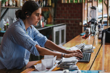 working with receipts and a computer doing financial tasks