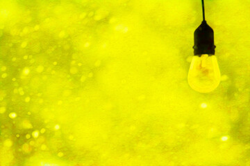 Lightbulb edgy modern lightbulb with snow falling (filtered photo) in Yellow white lightbulb, light, epiphany, idea, lightbulb moment, snow, snowfall, falling, snow winter, modern, w/Snow Falling