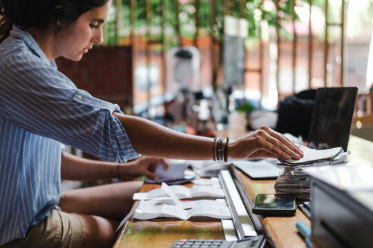 woman organizing recepits at her small business