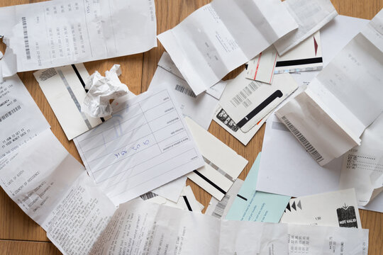 Close-Up Of Messy pile of Receipts and tickets on the floor - ugc 
