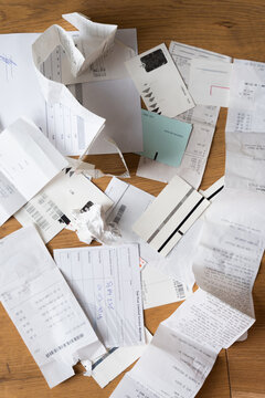 Close-Up Of Messy pile of Receipts and tickets on the floor - ugc 