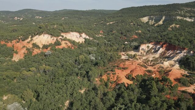 Aerial footage of Red sands and abstract Rustrel canyon moher cliffs landscape. Provencal Colorado near Roussillon,in the Vaucluse department - Southern France.