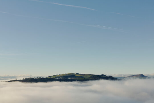 Hill surrounded by cloud
