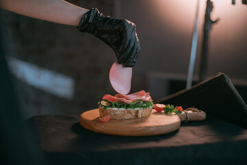 Professional shooting of food in advertising and cinema. Close-up. The work of a food stylist on the set.